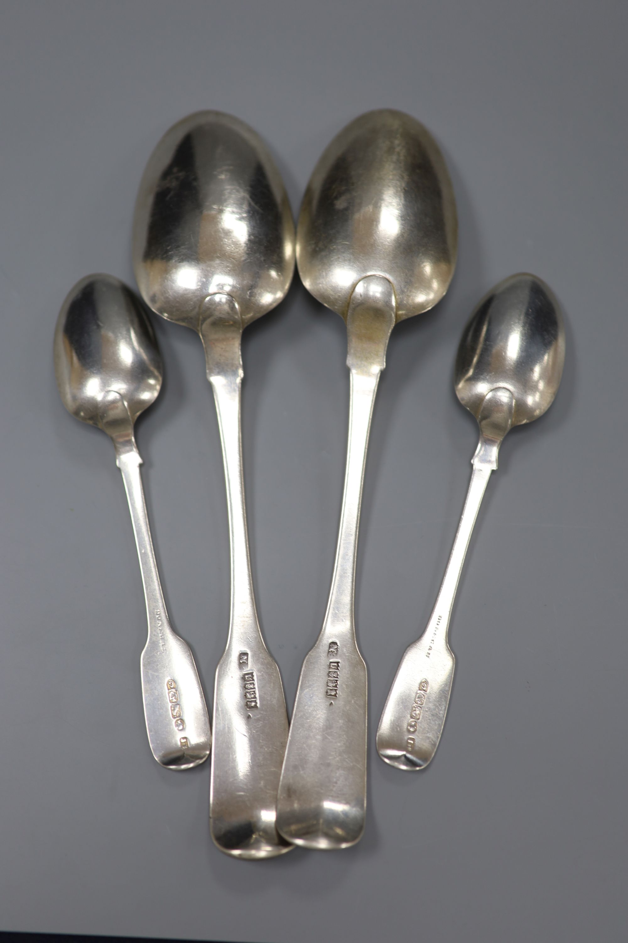 A pair of George III Irish silver fiddle pattern table spoons Samuel Neville, Dublin, 1816 and 2 others